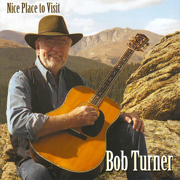 A Nice Place to Visit CD showing Bob Turner playing a guitar in the mountains